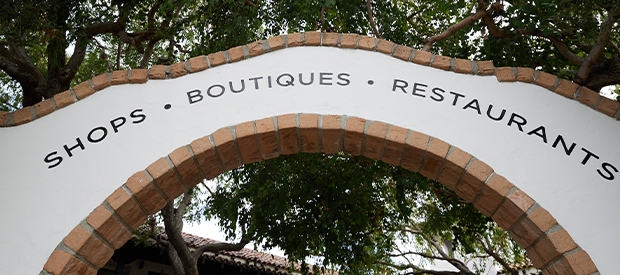 Sign displaying shops and boutiques